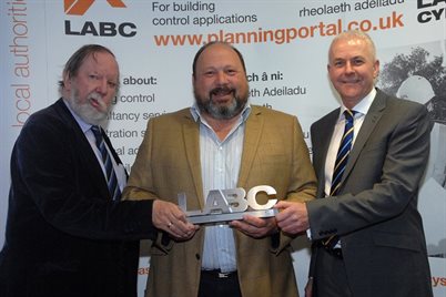 LABC chief executive Paul Everall, David Frost, and Colin Blick on behalf of the Welsh Government