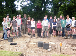 Students from Cardiff University history and archaeology department standing at the dig site