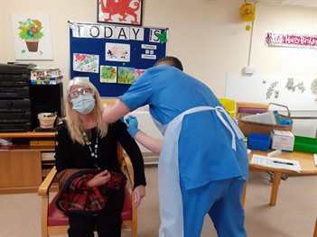 Sherida Dixon receiving vaccine