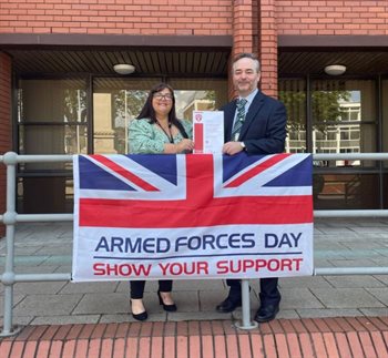 Abi Warburton with the Armed Forces Flag