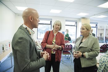 MS Rebecca Evans talking with Leader of the Council, Lis Burnett, and Director of Corporate Resources, Tom Bowring