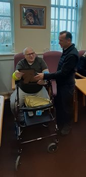 Paul Beechey accepting a certificate from Alun Cairns from the Prime Minister Rishi Sunak