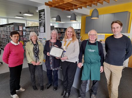 Line up from right to left: Jennifer Ryan (Library Volunteer), Clare Richardson (Trustee), Mary-Anne Marsden (Volunteer Library Manager), Carolyn Mizra-Davies (Chair of Dinas Powys Community Council), Barry Hawkins (Library Café Volunteer) & Phil Gauci (P