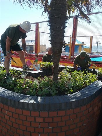 Parks team working on flower beds at Barry Island