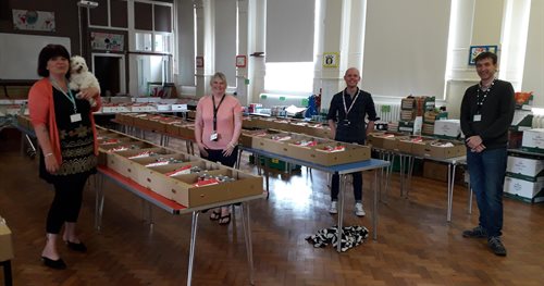 Rob, Tom and staff at Gladstone school sorting care packages